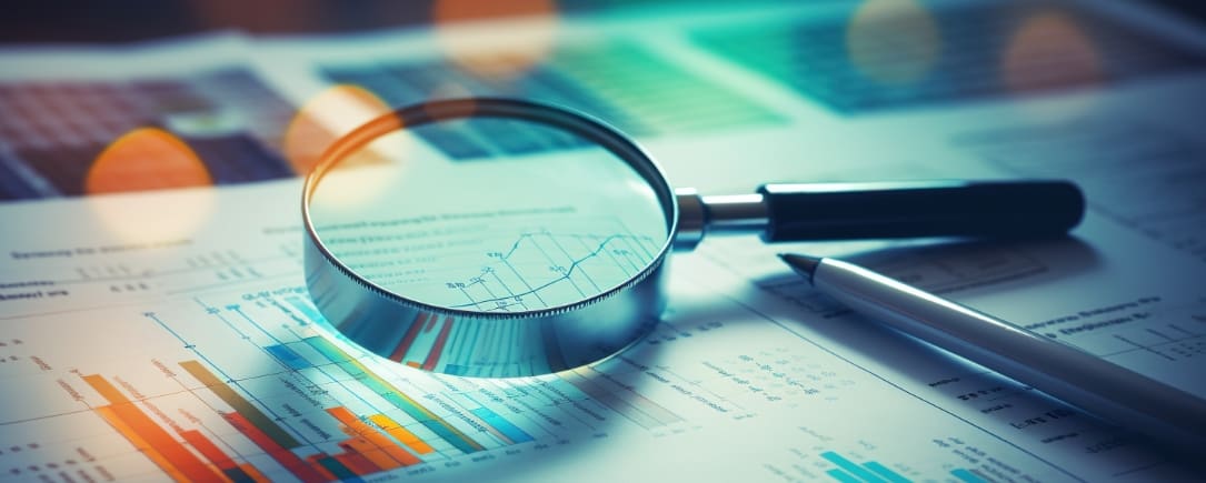 Modern ESG Screening Investing A close-up view of financial documents, graphs, and charts under a magnifying glass, suggesting an analysis of financial data
